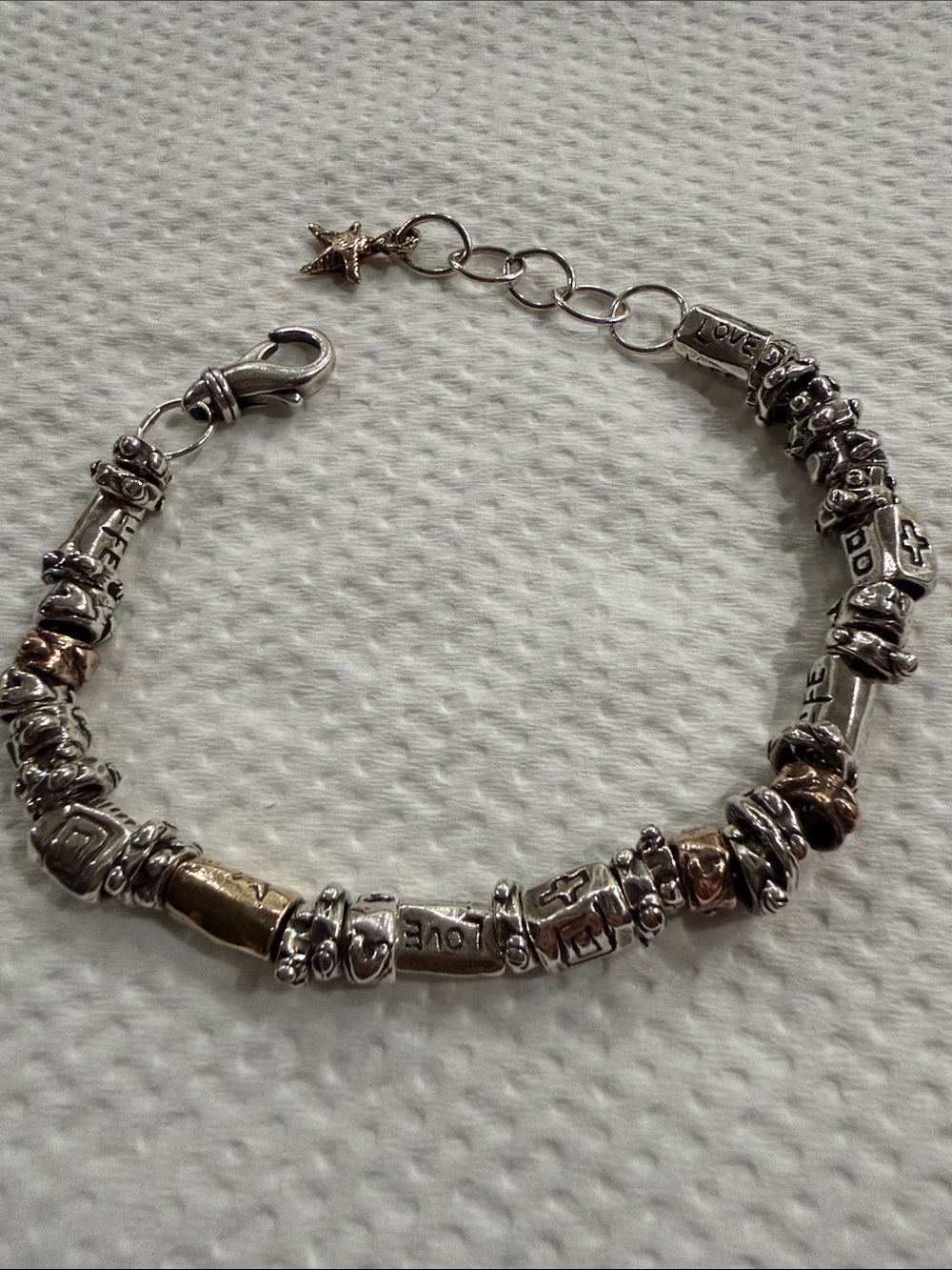 Beautiful Jes Maharry Labor of Love bracelet in gold and silver beads.
